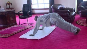 'President Museveni demonstrating how to engage in fitness drills indoors'