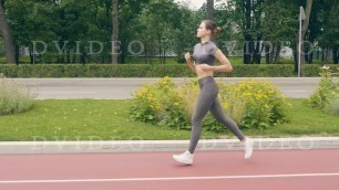 'Fitness woman running on summer park at morning workout Sport lifestyle'