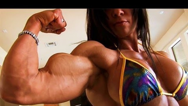 'Perfect Fitness Muscle Woman flexing her strong ripped biceps'
