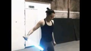 'Daisy ridley using the light saber'