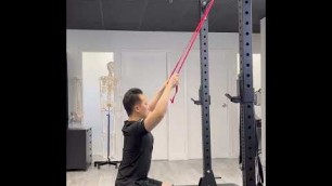 'Banded Lat Pulldown - home exercise to engage the Latissimus Dorsi muscle'