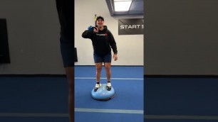 'Fitness Rx Exercise Library: Half Rack BOSU Ball Squat'
