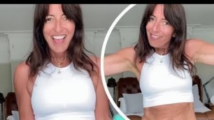 '✅  Davina McCall, 52, flaunts her enviably taut abs in white crop top and leggings as she shares a g'