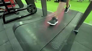 'Woman running exercise on track treadmill at fitness gym'